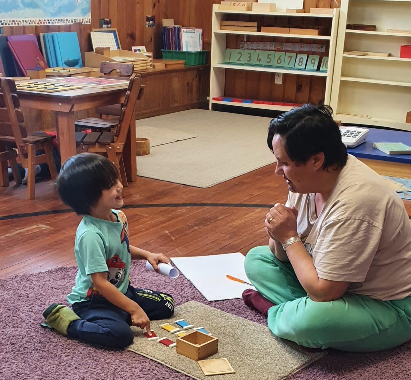Montessori 3-6 - teacher working one to one with a child in Napier